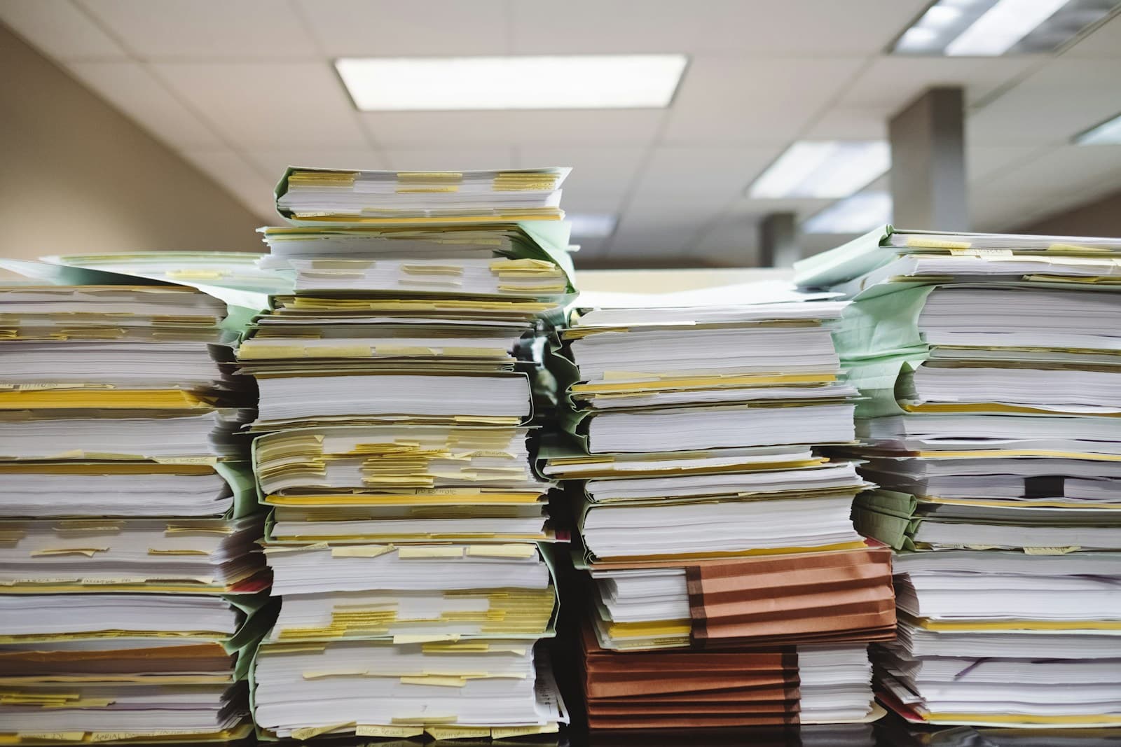 Stacks of paperwork illustrating the case study bottleneck